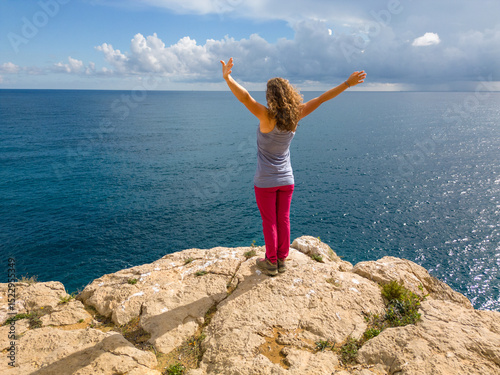 Woman enjoying view at Costa Blanca coastline photo