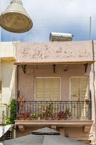 Fototapeta Naklejka Na Ścianę i Meble -  A Mediterranean old town. Historic buildings stand in narrow streets. Daytime city view in Rethymno, Crete, Greece
