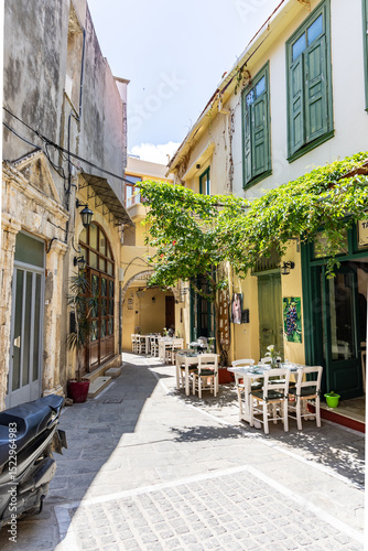 Fototapeta Naklejka Na Ścianę i Meble -  A Mediterranean old town. Historic buildings stand in narrow streets. Daytime city view in Rethymno, Crete, Greece