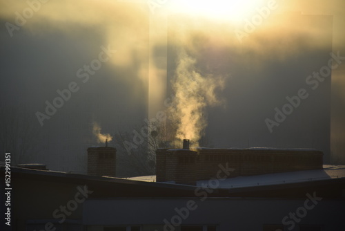 Chimneys polluting city with smoke and smog