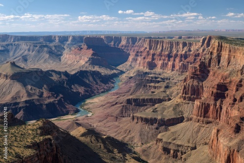 Arizona's iconic canyon reveals its vibrant colors and immense scale, showcasing 