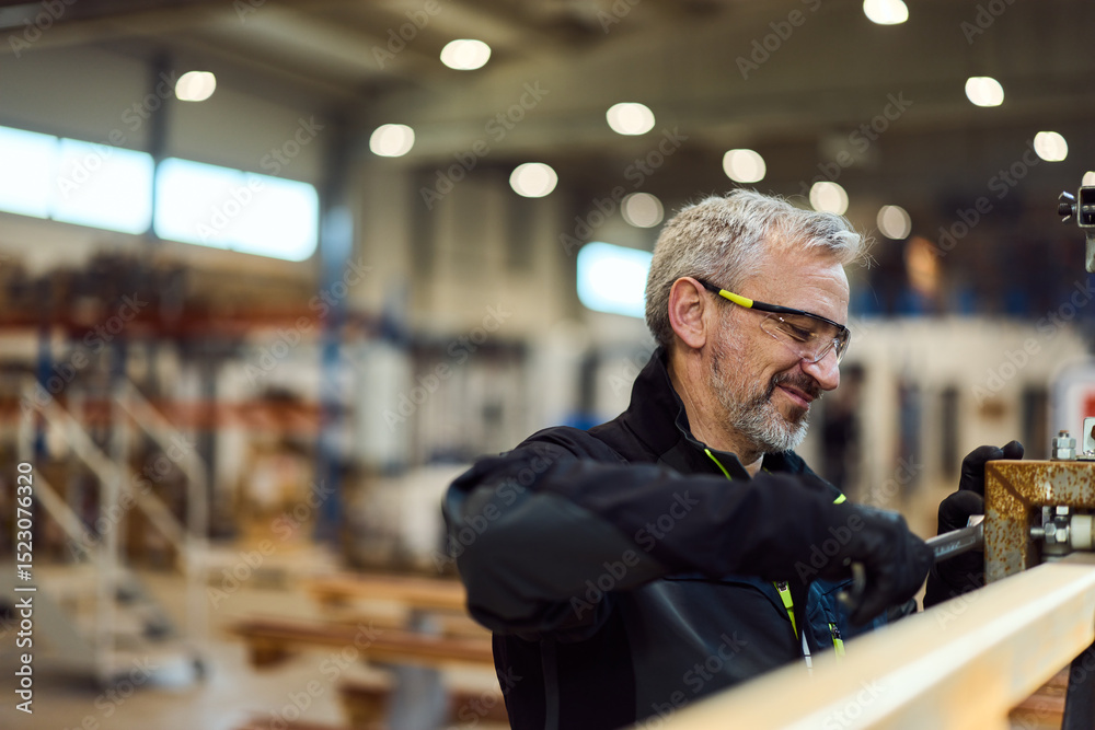 Fototapeta premium Professional Craftsman Working Diligently with Tools in a Workshop Environment