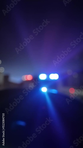 Defocused flashing red and blue lights, concept of police sirens and emergency