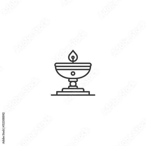 Iconic diya glows brightly indoors offering light symbolism