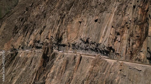 Aerial drone view of vehicle navigating the treacherous curves of Zojila Pass.