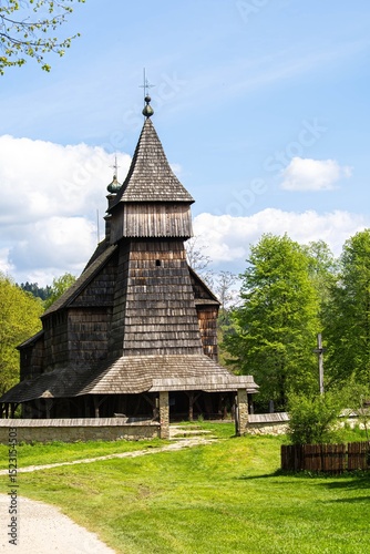 Fototapeta Naklejka Na Ścianę i Meble -  External view of the beautiful wooden church in the open air museum in Sanok in the Bieszczady Mountains in Poland