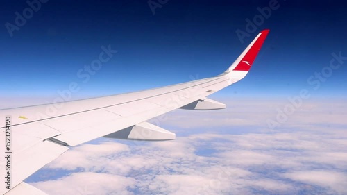 Vienna, Austria - April 7th 2025: Window View Over Wing from Austrian Plane at cruising altitude before landing in Vienna
