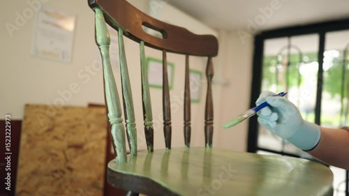 Slow motion furniture restoration. Painting wooden chair