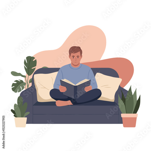 Young man relaxed reading book on comfortable sofa at home calm male room cozy flat blue gray adult