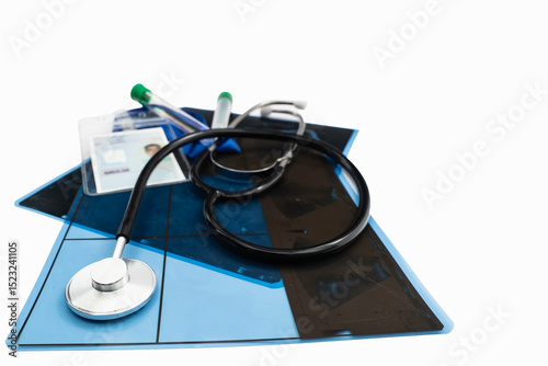 Stethoscope, medical report, test tubes and patient card are lying on a table, representing healthcare and medical checkups