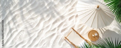 Overhead view of beach scene with white umbrella, chaise lounge and tropical leaves.