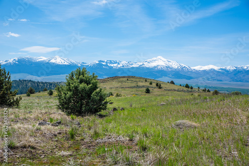 Snowy Mountains And Grassy Hill