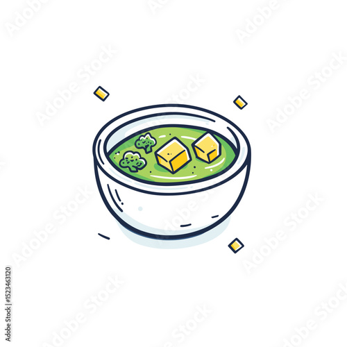 Bowl of green soup with tofu and broccoli