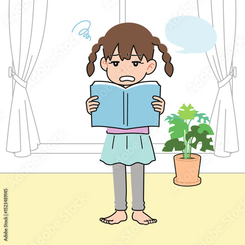 居間でいやいや教科書を音読する女の子