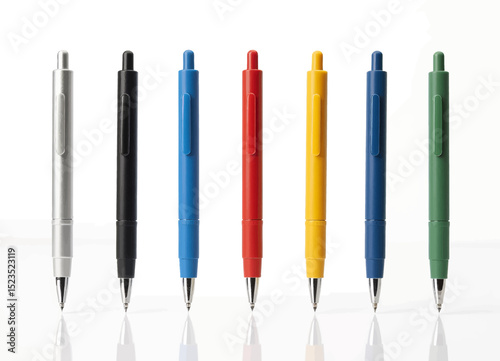 Modern Pens in Assorted Colors on Reflective Surface