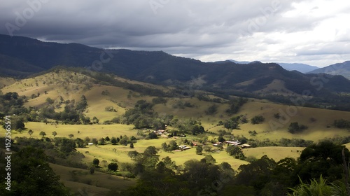 Rolling hills and valley under stormy skies