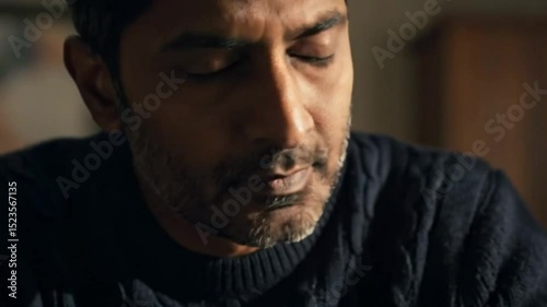 Pensive moment: a man deep in thought with intense focus and reflection