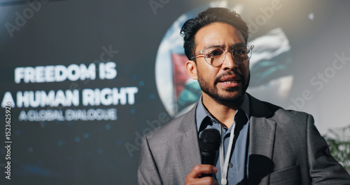 Photos Man, speaker and mic at conference event of conflict, freedom and human rights speech