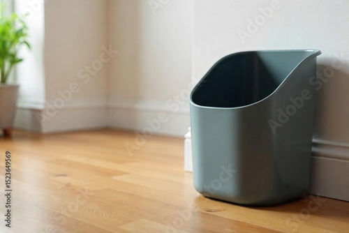 A sleek, modern litter basket sits on a polished wooden floor, ready for everyday use Its simple design complements any room Perfect for homes, offices, or public spaces , organized, waste management