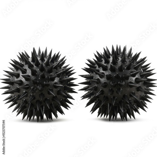 Two spiky massage balls isolated on white background
