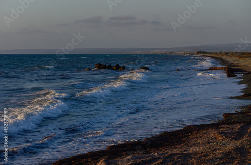 Golden Sunset Reflections on the Cyprus Shoreline