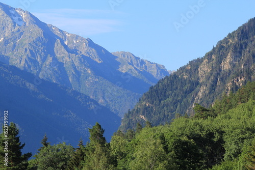 mountain peaks of elbrus region in dombai in midsummer