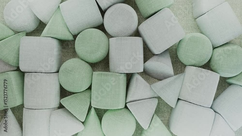Green and Gray Pillows in Various Shapes Falling 