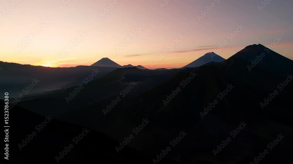 Volcanic Peaks at Sunrise: A Majestic Mountain Range Volcanic Peaks at Sunrise: A Majestic Mountain Range