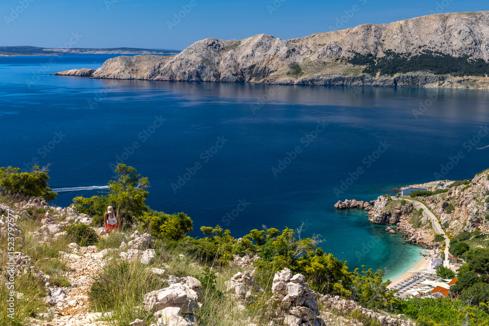 Obraz premium Hiking trail on the island of KRK, high mountains, gorge and the blue Adriatic Sea,