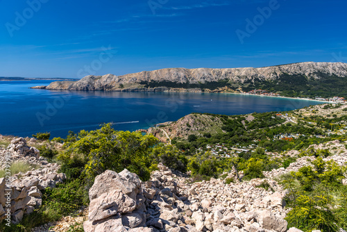 Fototapeta Naklejka Na Ścianę i Meble -  Hiking trail on the island of KRK, high mountains, gorge and the blue Adriatic Sea,