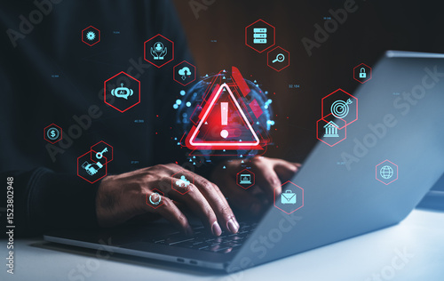 Cybersecurity alert with hacker typing on laptop surrounded by digital warning icons.