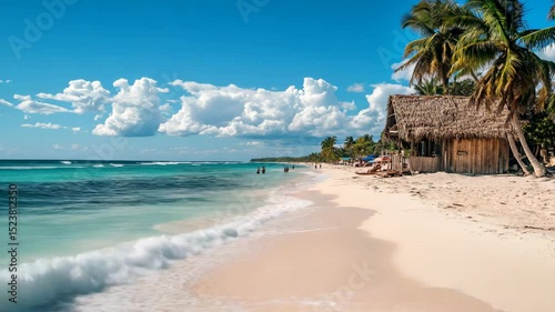 A beach with a small hut on the shore. The hut is made of wood and has a blue umbrella. The beach is calm and peaceful, with a few people walking around. The sky is clear and blue