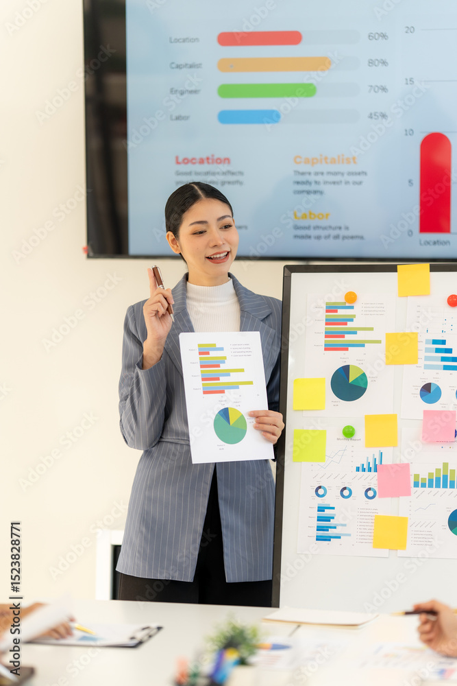 Fototapeta premium Businesswoman Presenting Data Charts