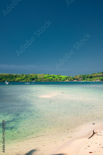 Fototapeta Naklejka Na Ścianę i Meble -  paradise beach with turquoise water, wooden pier and tropical palm trees, summer holidays in Thailand, Koh Kood