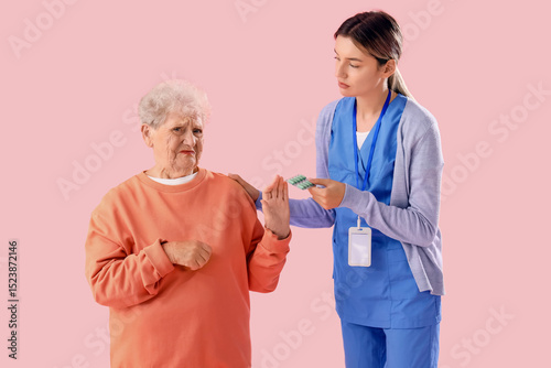 Senior woman refusing to ta...