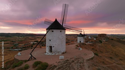Aerial view of the windmills of Consuegra at sunset, Castilla-La Mancha, Spain.