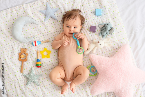 Cute little baby with rattl...