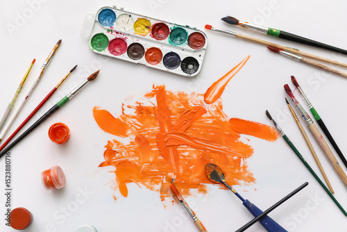 Artist brushes, paints and ...