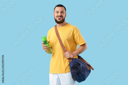 Young man with sports bag a...