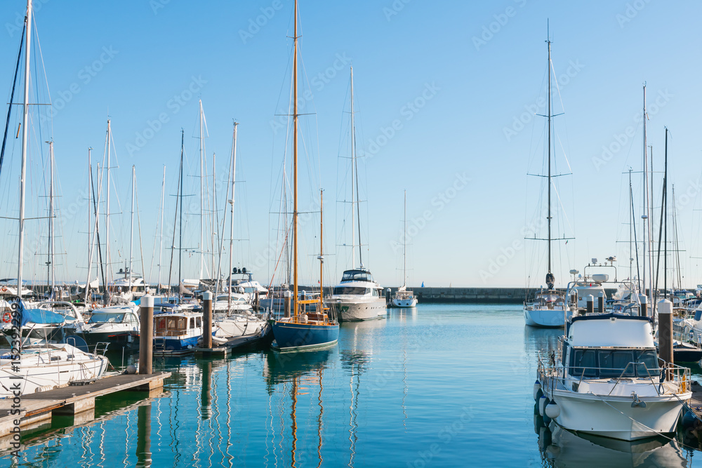 Fototapeta premium Cascais, Portugal. Yachts and boats in Cascais Marina at sunny day. Coast of Atlantic ocean.