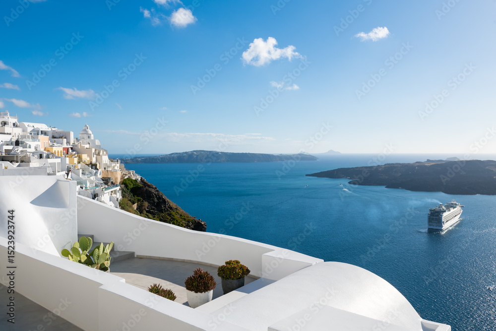 Fototapeta premium White architecture in Santorini island, Greece. Beautiful terrace with sea view at sunny day.