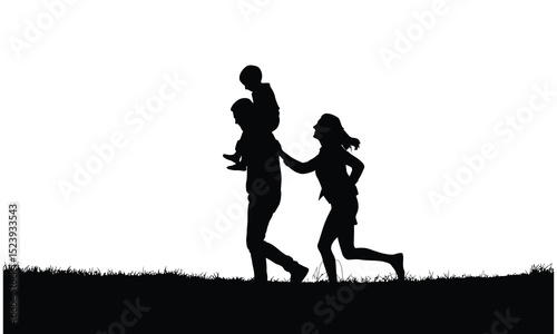 Happy family silhouette walking in grass