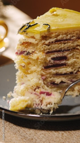 Forking the cake close up vertical