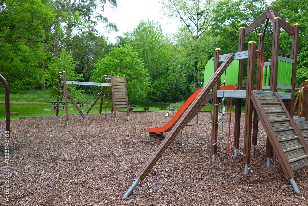 Fototapeta premium Children playground equipment stands ready for fun and games in park