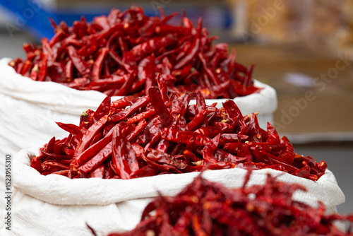 Fototapeta Naklejka Na Ścianę i Meble -  Red chilli pepper spices for sale on a spice market in Mumbai, India, fresh ingredients for cooking indian food