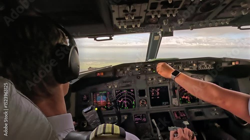 Airline pilot in commercial aircraft cockpit during flight