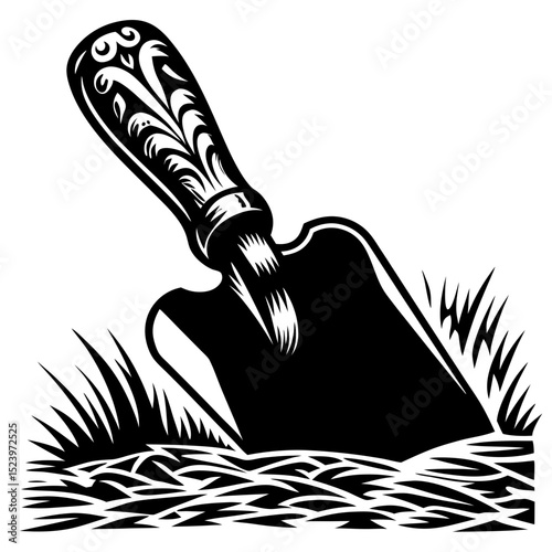 Ornate trowel in the garden soil