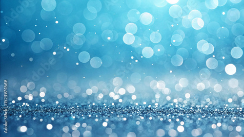 Gradient blue background decorated with glitter, bokeh and ribbons.