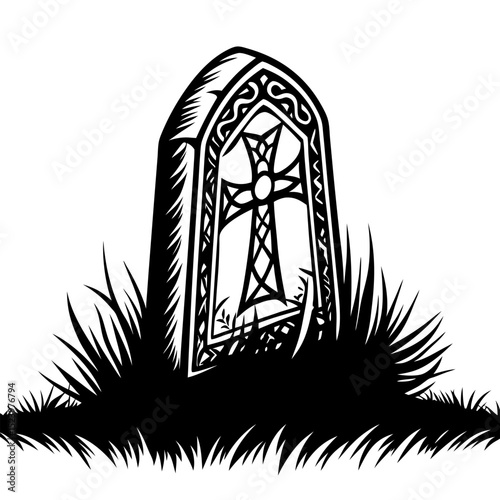 Celtic cross headstone in grassy grave