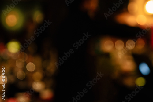 Warm Golden Bokeh Lights in a Dark Ambient Restaurant Scene